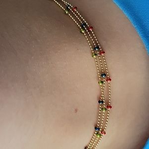 14K yellow gold necklace with enamel beads.